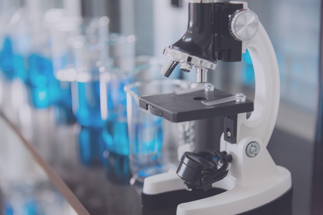 Microscope and test tubes in laboratory and laboratory tools in reseach laboratory