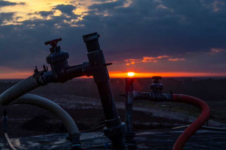 Sunrise over a Landfill showing a methane collection pipeline