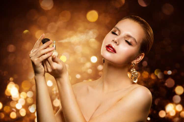 Perfume, Luxury Woman Spraying Fragrance, Aroma and Fashion Model Beauty