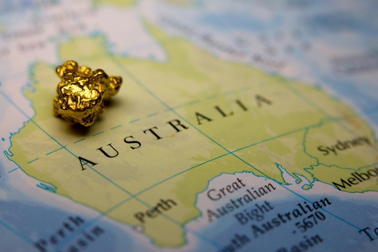 Gold nugget on top of map of Australia