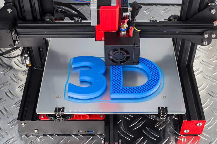 Red black 3D printer printing blue logo symbol on metal diamond plate future technology modern concept