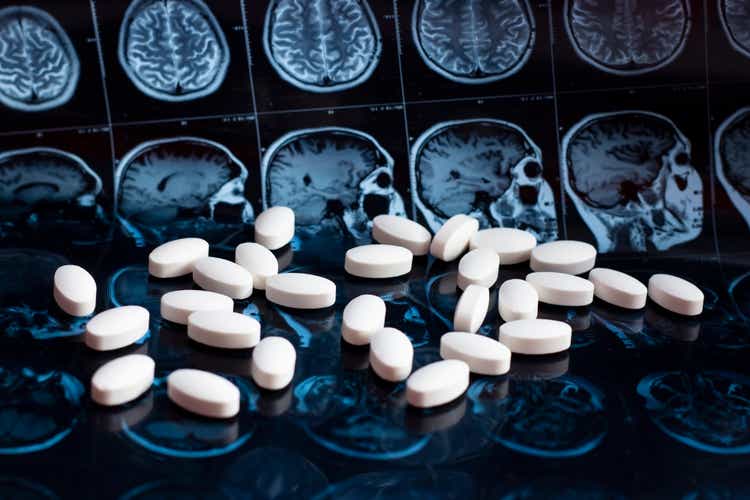Cassava Sciences: On The Defense Once Again (NASDAQ:SAVA) - Seeking Alpha Pharmaceutical medicine pills on magnetic brain resonance scan mri background. Pharmacy theme, health care, drug prescription for tumor, alzheimer, mental illness treatment medication