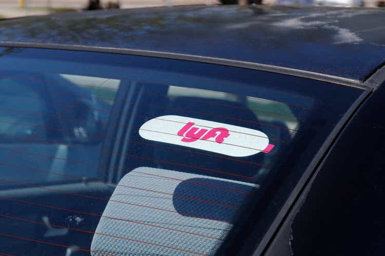 Car rental with lift sticker.  Lyft and Uber have replaced many taxi cabs with smartphone apps for transportation.