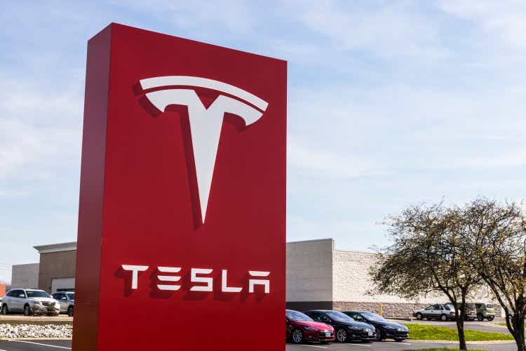 Tesla Service Center.  Tesla designs and builds the Model S IV electric sedan