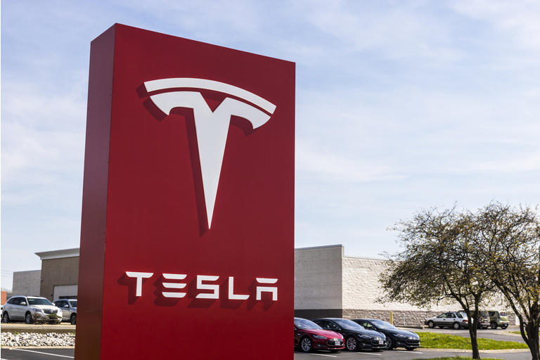 Tesla Service Center. Tesla designs and manufactures the Model S electric sedan IV