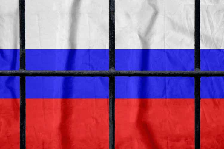 Russian flag behind black metal bars of a prison grate without shadows