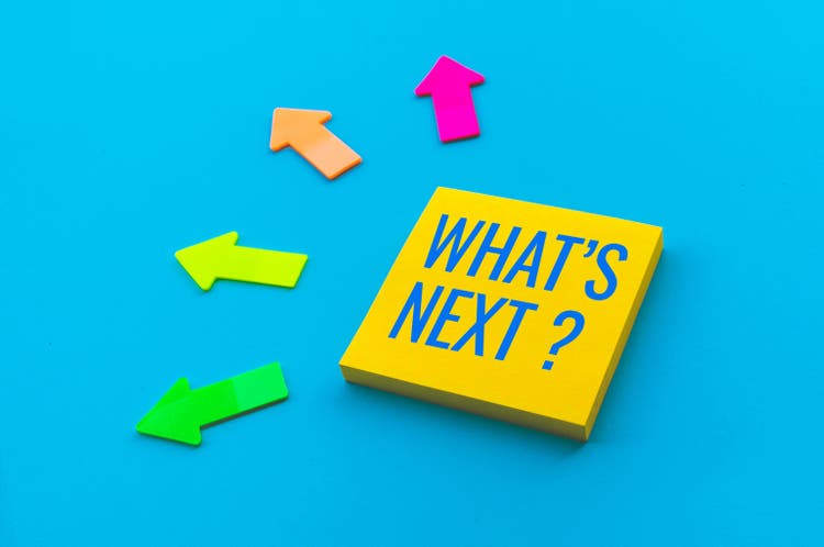 What’s next ? concepts with text on notepaper and arrow