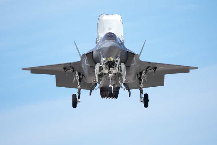 Front view of a F-35 Lightning II hovering against the sky