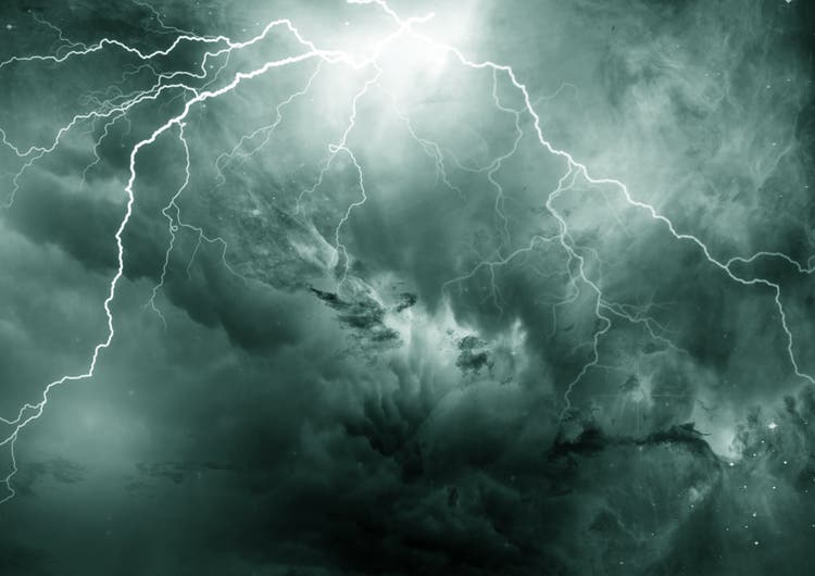 sky covered with dark clouds cut by lightning and thunder. Storm approaching.