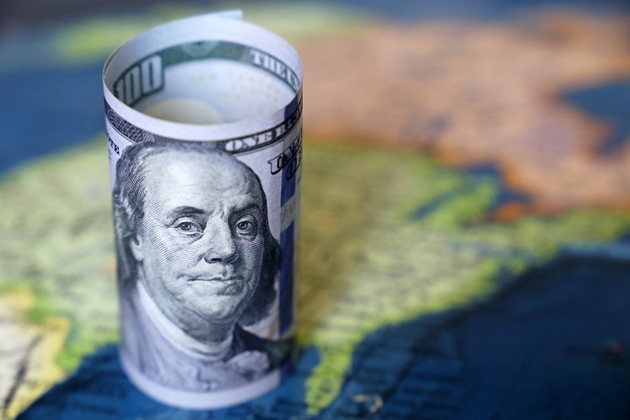 Dollar bills on the map of USA