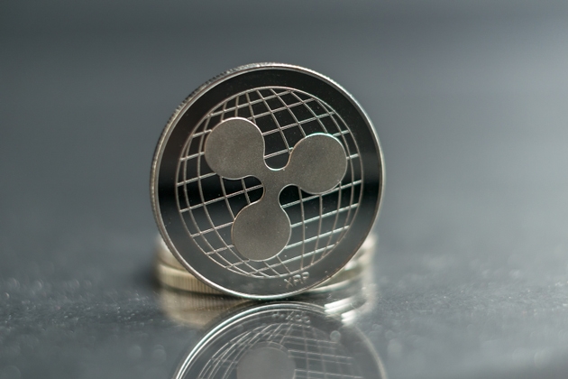 Ripple. xrp Crypto currency silver coin, Macro shot of ripple coin isolated on background, cut out Blockchain technology,