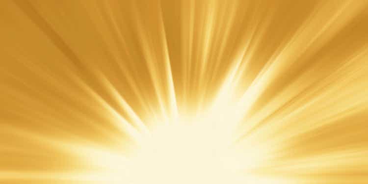 Abstract yellow background. Magic light with gold burst