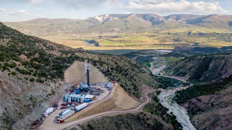 An Aerial View Of A Fracking Drill Rig On The Side Of A Mountain In Colorado In Late Spring