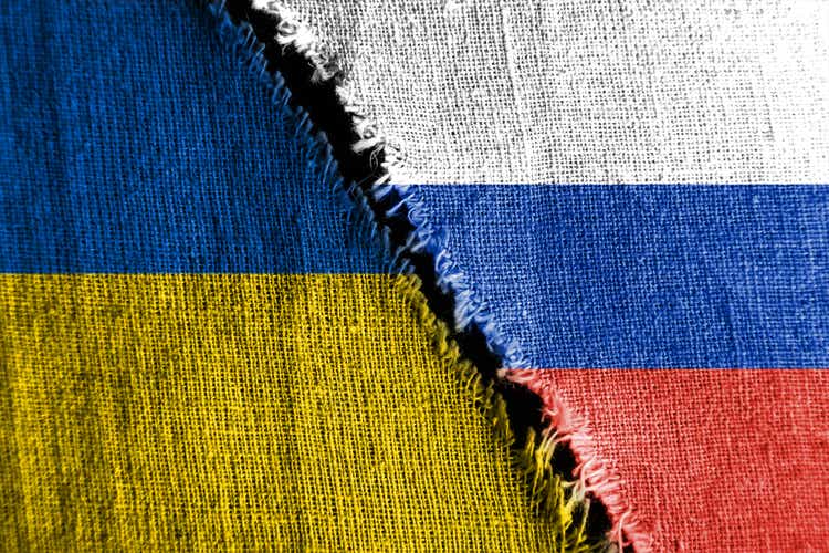 The gap between the two flags, Russia and Ukraine, as a concept of political confrontation.