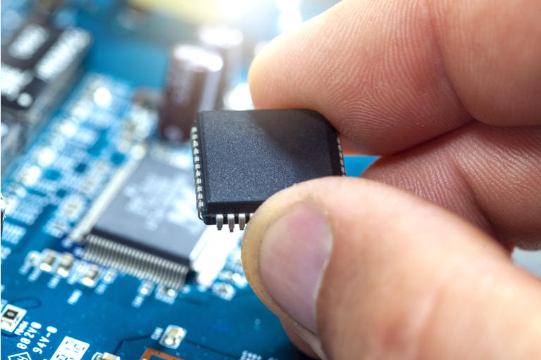 The electronics engineer assembles the chip