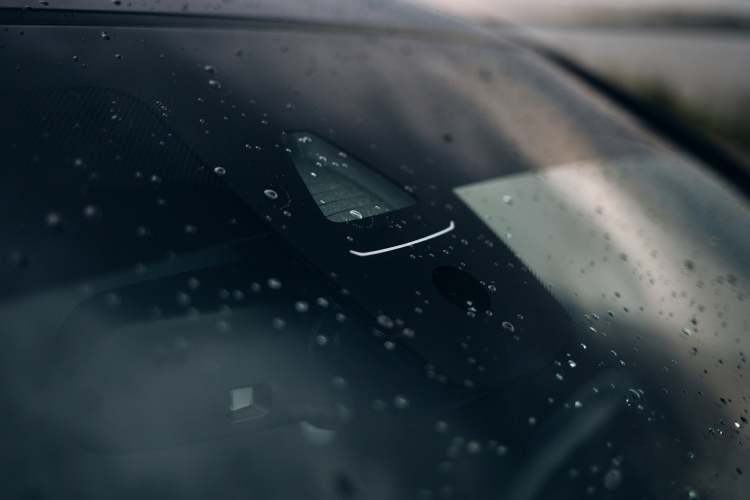 Rain and light sensor on the windshield of the car