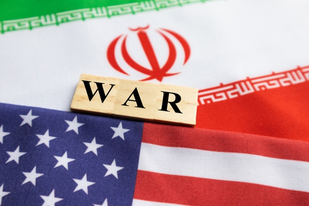 Concept of bilateral relations of US and Iran showing with flag and War with wooden block letters