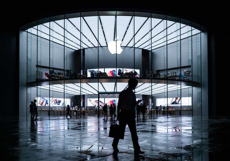 Apple stores in the evening, busy Apple stores and people on the road