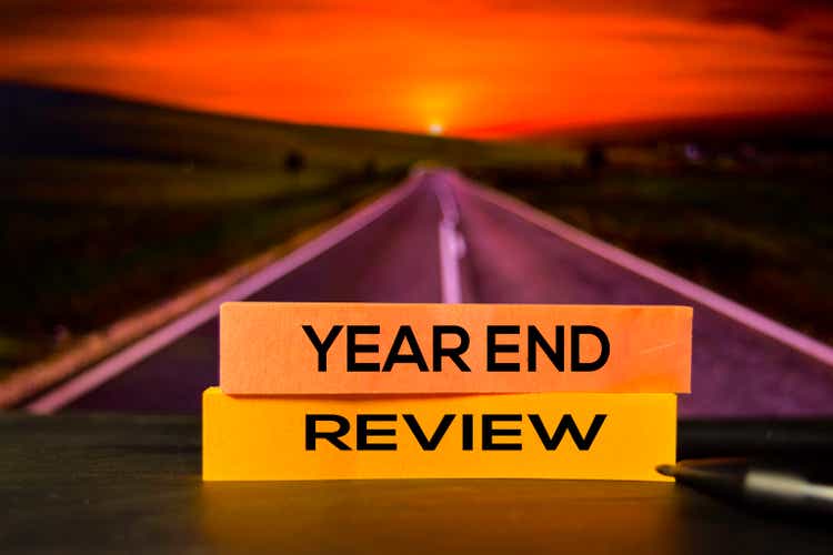 Year End Review on the sticky notes with bokeh background