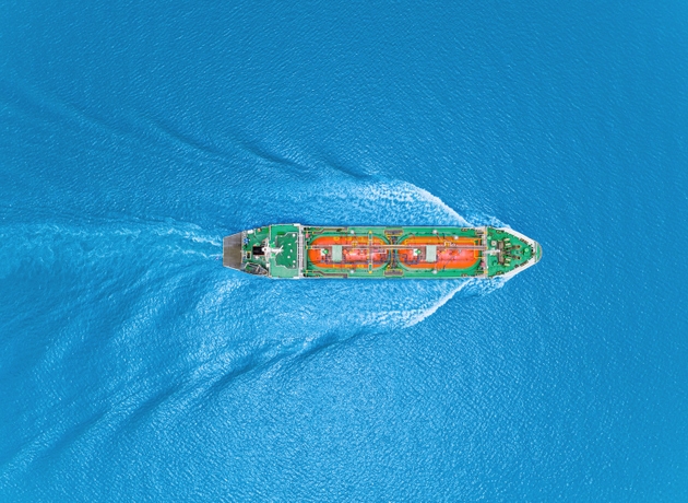 Aerial top view Oil ship tanker or LPG tanker transportation oil from refinery on the sea.