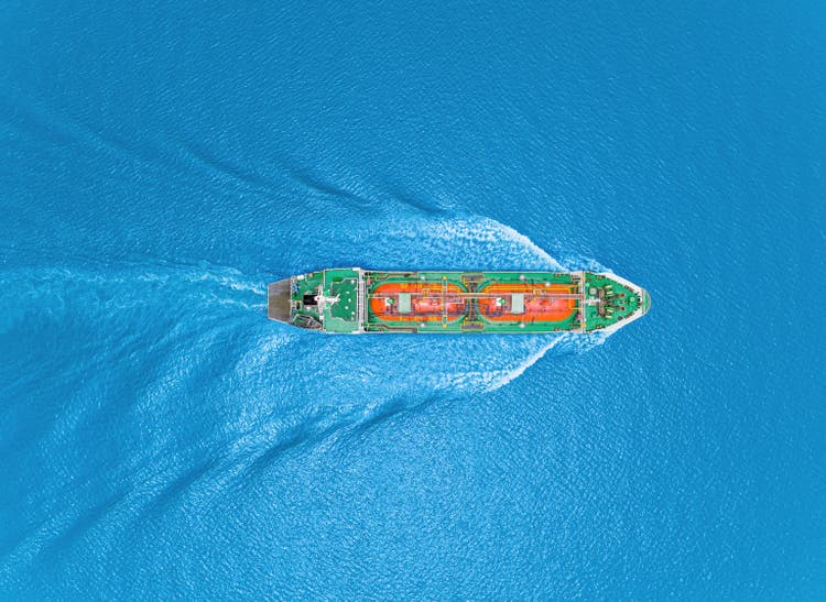 Aerial top view Oil ship tanker or LPG tanker transportation oil from refinery on the sea.