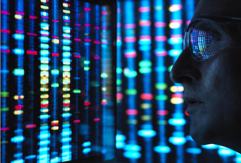 Genetic Research, scientist viewing DNA information on screens