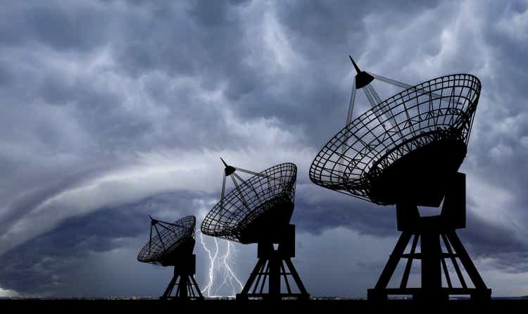 Satellite dishes at thundershtorm.