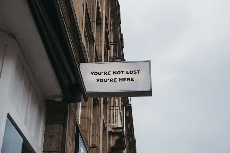 "You are not lost, you are here" sign.