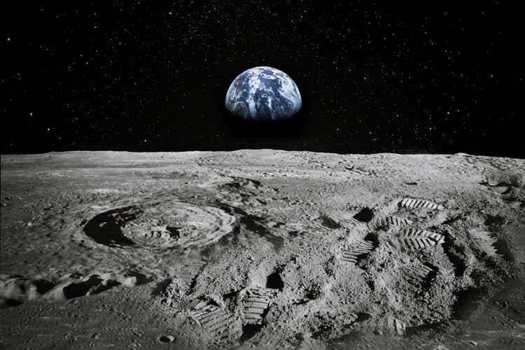 View of Moon limb pinch Earth rising connected nan horizon. Footprints arsenic an grounds of group being location aliases awesome forgery. Collage. Elements of this image furnished by NASA.