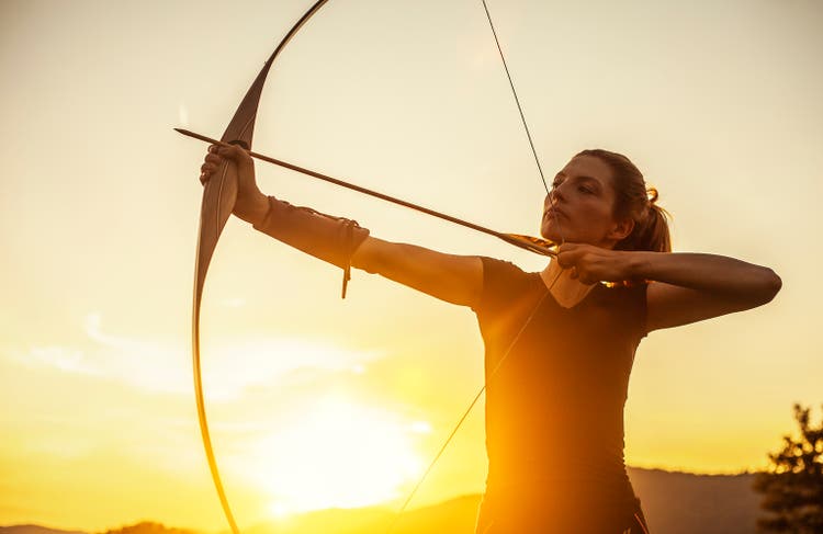 Woman Aiming In Archery