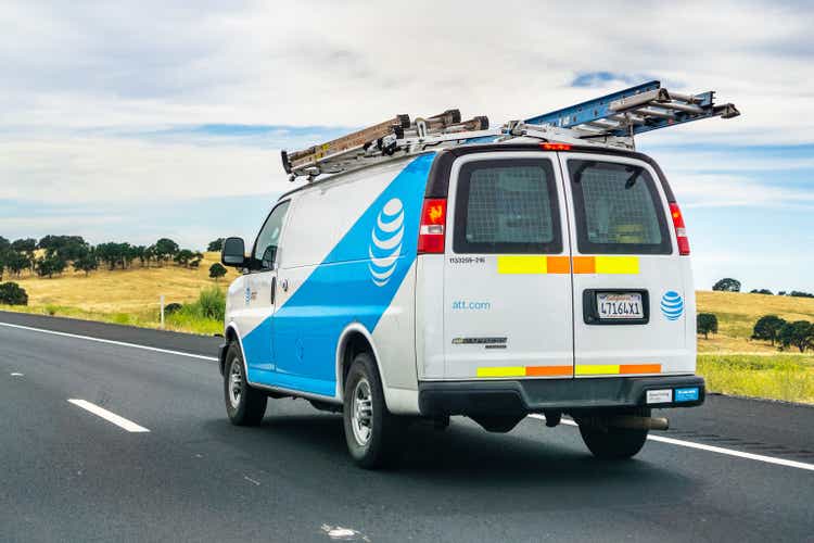 AT&T service van driving on the freeway