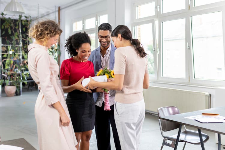 men and woman celebrating advancement in office