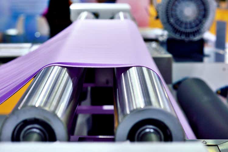 Close-up of Purple Cloth at Textile Equipment"s Conveyor Belt