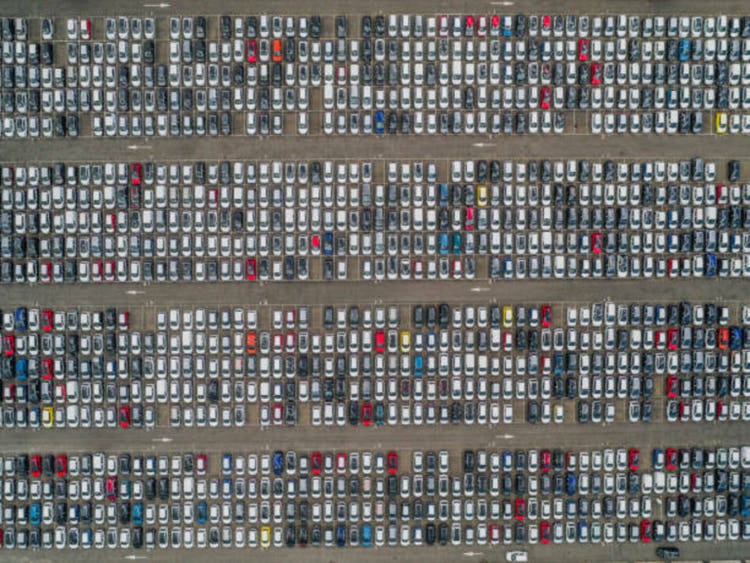 Drone shot directly above a large group of cars, Italy