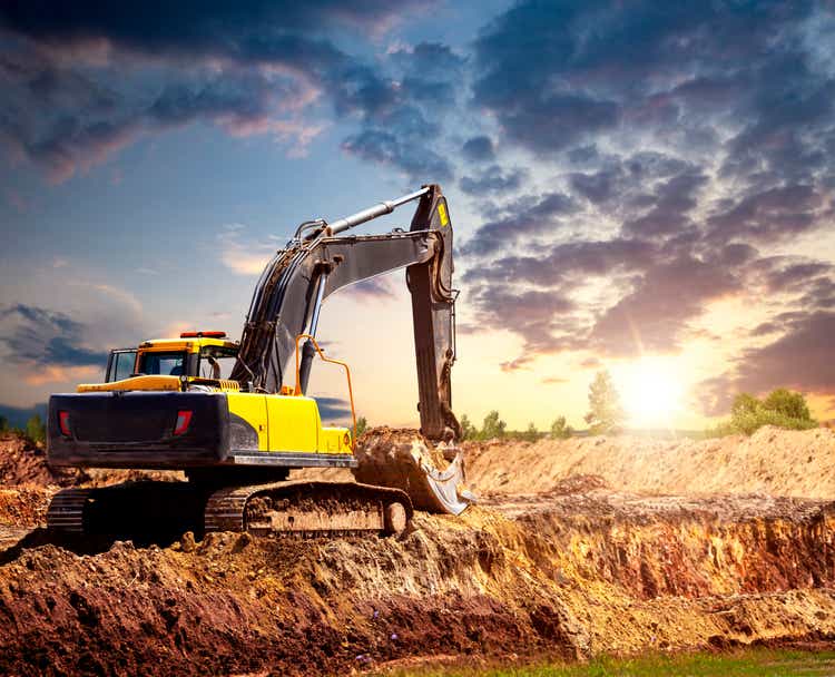 Excavator at the construction site in the evening.