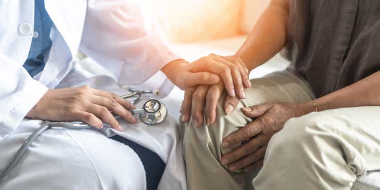 Parkinson"s disease patient, Arthritis hand and knee pain or mental health care concept with geriatric doctor consulting examining elderly senior aged adult in medical exam clinic or hospital