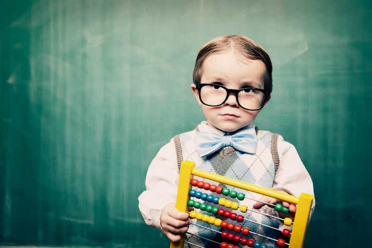 Little Boy Dressed as Acccountant using Abacus