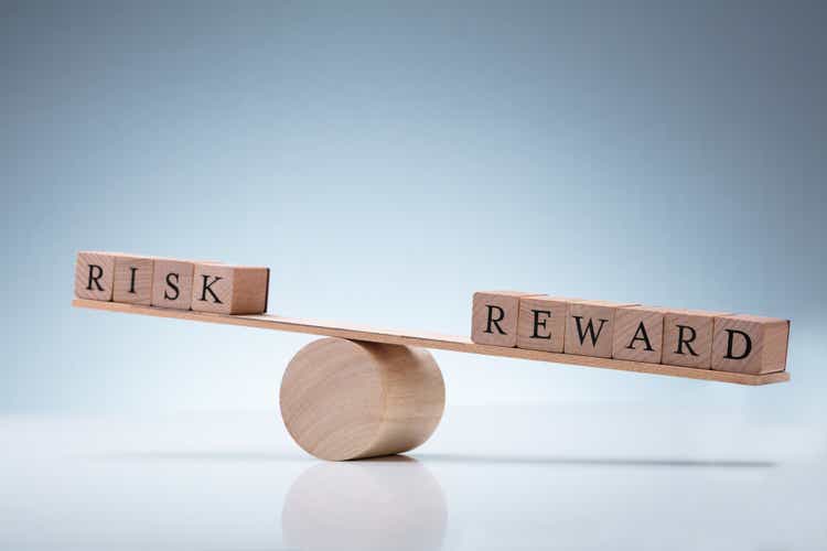 Risk And Reward Wooden Block On Seesaw