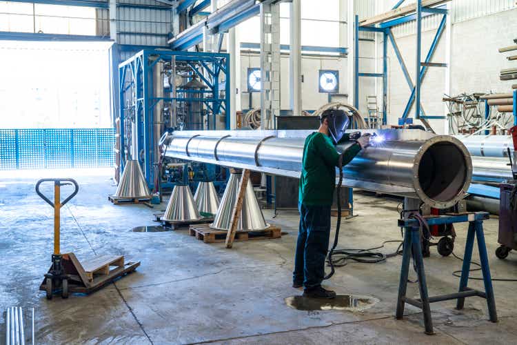 Welder welding stainless steel big pipe