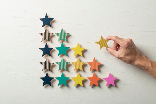 Colorful wooden stars lined up in steps