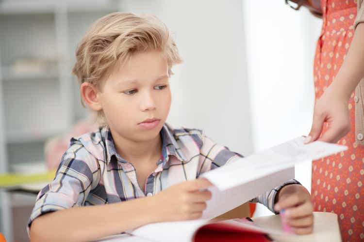 Schoolboy feeling sad after getting bad mark for final test