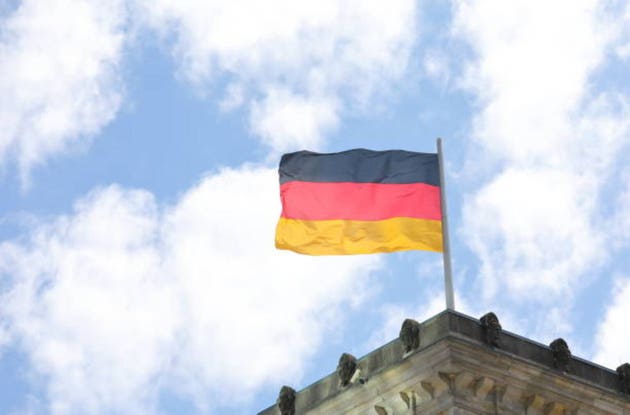 German national flag Germany in blue sky