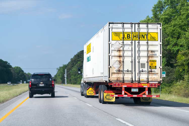 Car and JB Hunt cargo transport truck on Interstate 85 I-85 road in Alabama