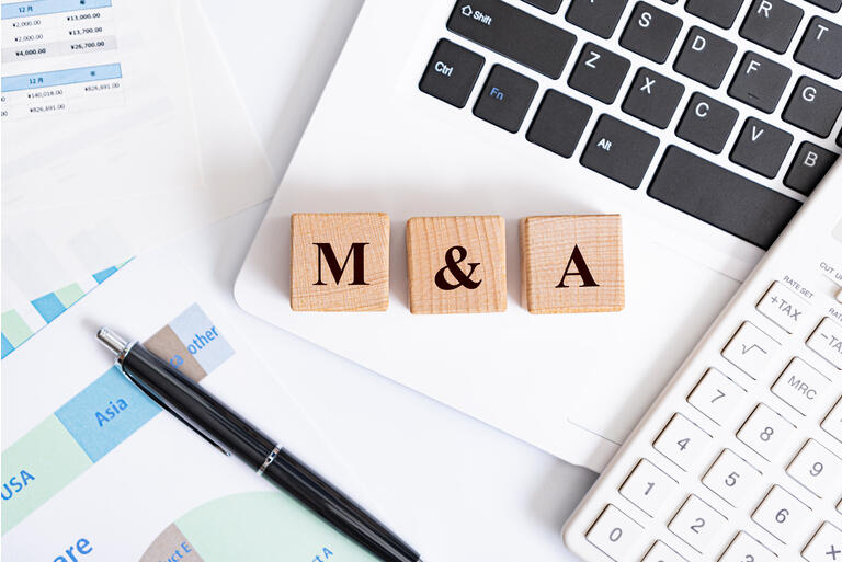 M&A word made with building blocks