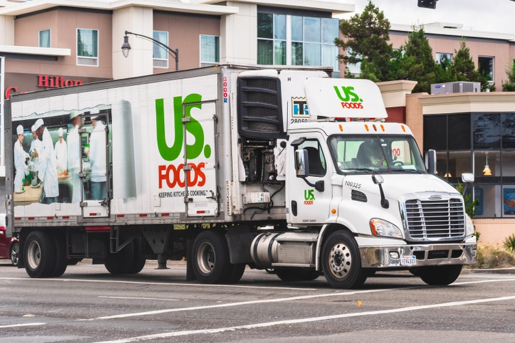 US Foods truck driving on a street