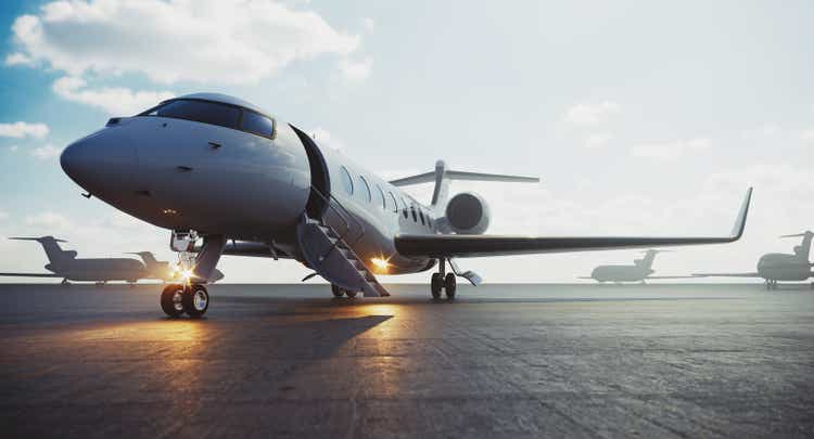 Corporate business class jet airplane parked at airfield and waiting vip persons for take off. Luxury tourism and business travel transportation concept. 3d rendering.