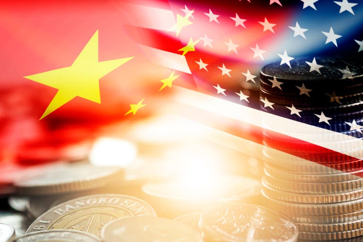 USA and China flag on coins stacking .It is symbol of economic tariffs trade war and tax barrier between United States of America and China.