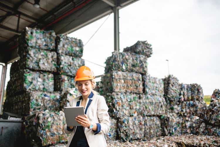 Female Resource Recovery Specialist Using Digital Tablet