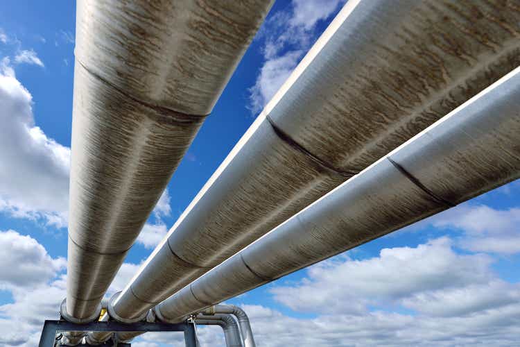 Three pipes reflecting the blue sky