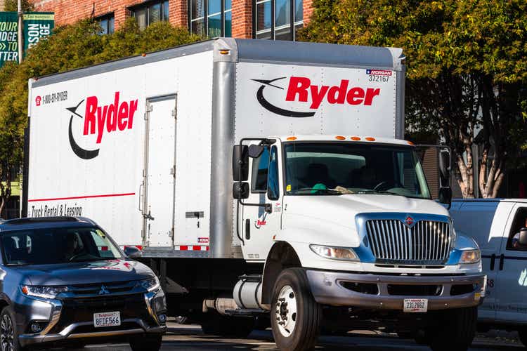 Ryder truck driving on a street